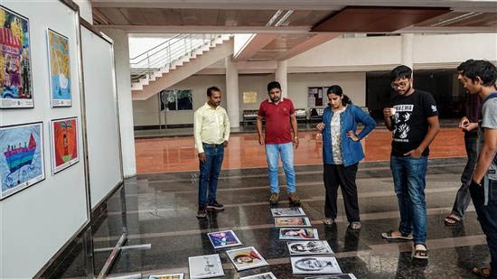 Planning the display at Khula Aasmaan art exhibition at IISER Pune
